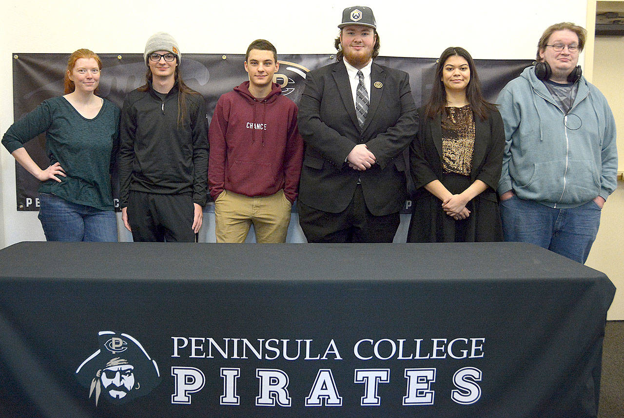 From left, Peninsula College esports coach Charlie Morrow stands with Overwatch team members Cameron Fouts, Levi Foy, Mike Roggenbuck, Ashley Frantz and Ted Cosmez. Not pictured are team members Katelyn Simmons and Damien Cundiff. Submitted photo