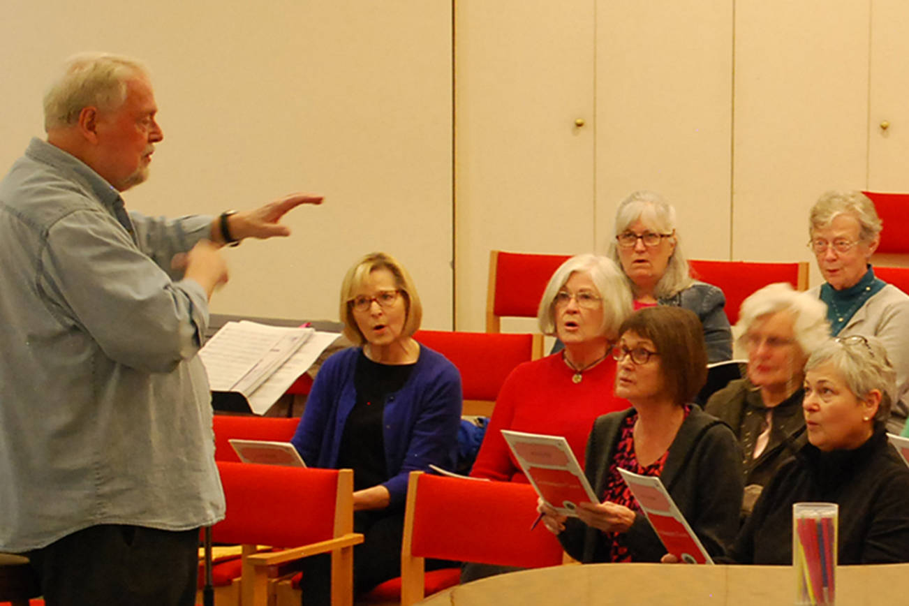 Jerome Wright, left, leads the Peninsula Singers in a rehearsal at Trinity United Methodist Church on Oct. 17. The Singers are preparing for their annual fall concert, with shows on Nov. 23 & 24, but are still recruiting more singers for all sections in the area who can read music. Sequim Gazette photo by Conor Dowley
