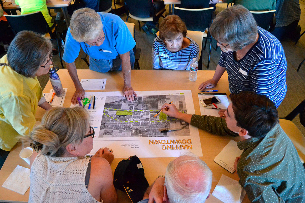 Some of the 40 attendees of a kick-off for the South Sequim Complete Streets Project brainstorm options on Aug. 28 to better connect traffic and pedestrians going east-west south of West Washington Street and north of U.S. Highway 101. Consultants plan to host another open house in 2020 to discuss a possible draft of the project. Sequim Gazette photo by Matthew Nash
