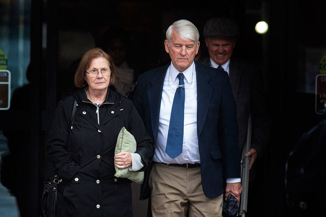 Virginia and Roger Moon of Sequim exit the Clallam County Courthouse on Monday as a jury deliberates on their lawsuit against the Clallam Transit System. The couple sued after Virginia Moon fell over a tree box at the Sequim Transit Center in 2015. (Jesse Major/Peninsula Daily News)