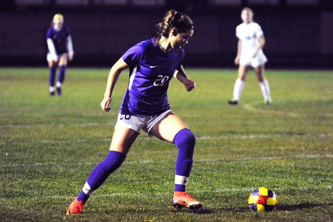 Hope Glasser turns on the ball in the second half of the Sequim Wolves’ 2-1 senior night win over the North Mason Bulldogs on Oct. 24. Glasser scored both Sequim goals to bring her season total to six goals, and helped bring the team closer to a district playoff berth. Sequim Gazette photo by Conor Dowley