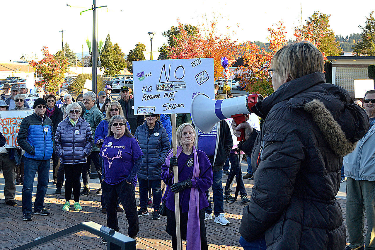 Jodi Wilke, chairman of Save Our Sequim, speaks to about 200 people on the Sequim Civic Center plaza on Oct. 28. She and others want Sequim city councilors to open the planning process for a proposed Medication-Assisted Treatment clinic to the public. Sequim Gazette photo by Matthew Nash