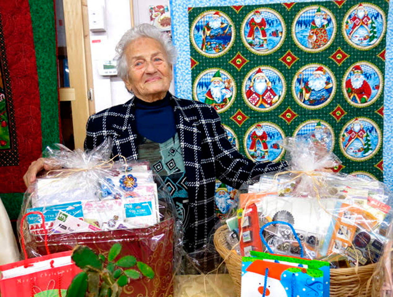 Tatiana Trailov, one of the Sequim Guild of Seattle Children’s Hospital group’s founding members, displays handmade wares at the guild’s holiday bazaar in 2017. Submitted photo