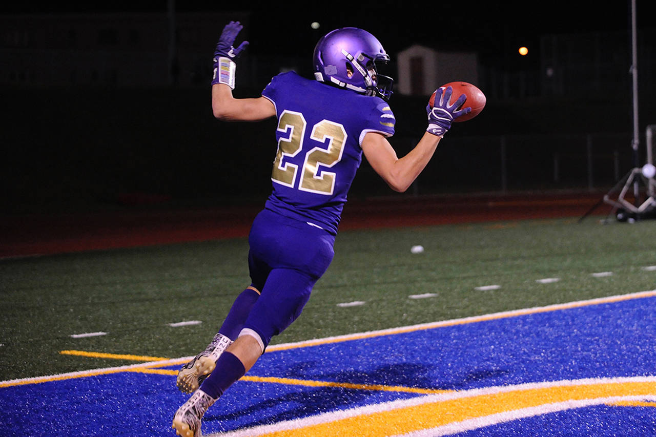 Sequim Wolves running back Walker Ward celebrates after scoring a touchdown off a screen pass in the second quarter of the Wolves’ 37-21 district playoff win over the River Ridge Hawks on Nov. 8. Ward had 164 yards rushing and one touchdown on 26 carries, plus two receptions for 40 yards and another touchdown on the night. Sequim Gazette photo by Conor Dowley