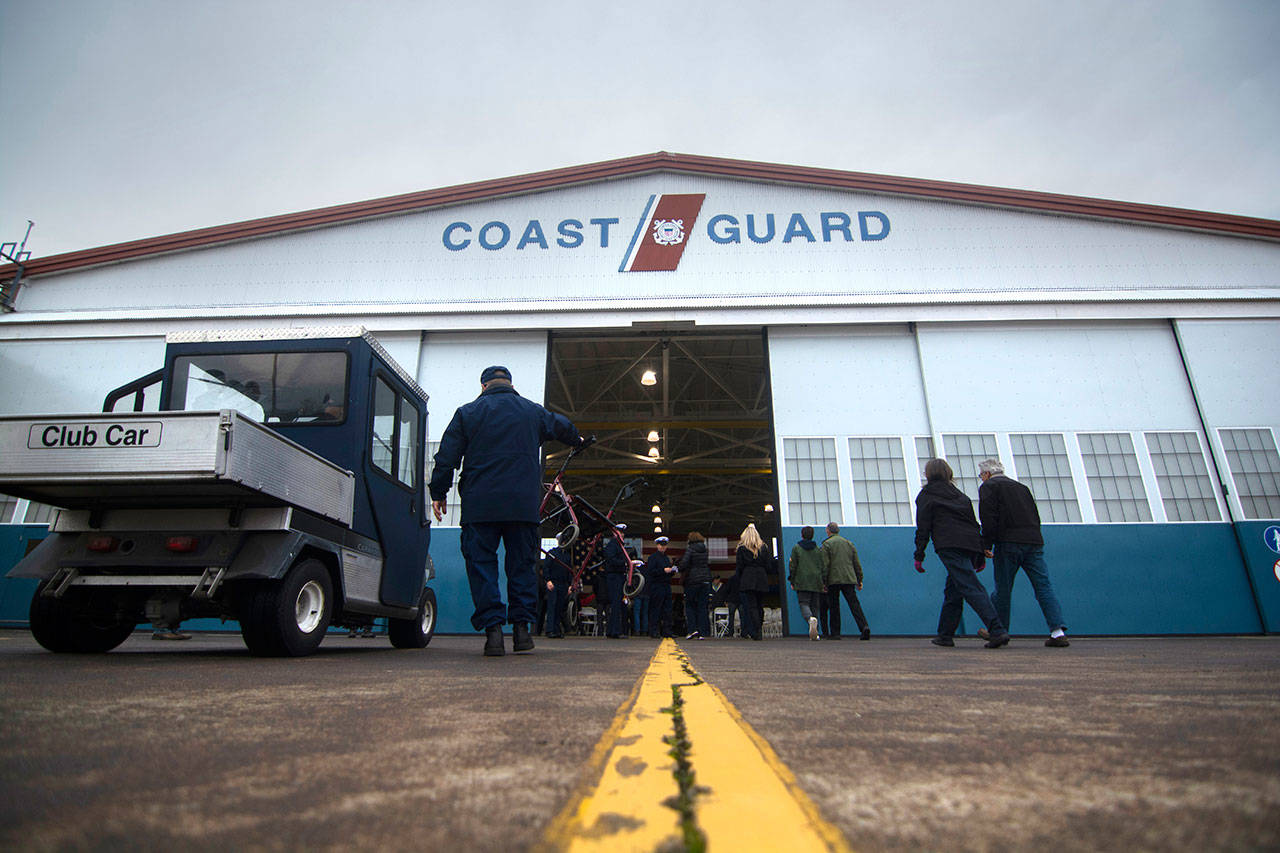 People arrive to the Veterans Day ceremony at U.S. Coast Guard Air Station/Sector Field Office Port Angeles on Monday. (Jesse Major/Peninsula Daily News)
