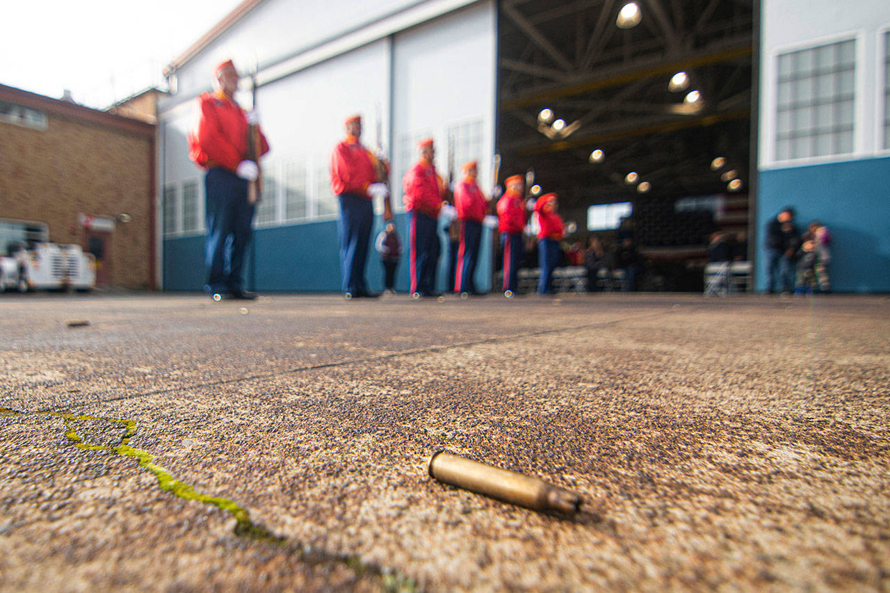Members of the Mount Olympus Detachment of the Marine Corps League perform a three-volley rifle salute at the Veterans Day ceremony at U.S. Coast Guard Air Station/Sector Field Office Port Angeles on Monday. (Jesse Major/Peninsula Daily News)