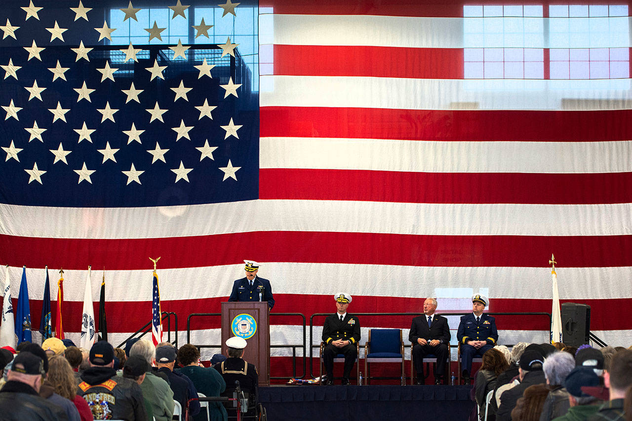 Cmdr. M. Scott Jackson, commanding officer of Coast Guard Air Station/Sector Field Office Port Angeles, delivers his remarks during the Veterans Day ceremony Monday. (Jesse Major/Peninsula Daily News)
