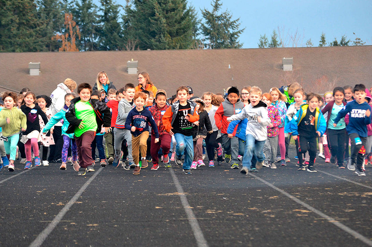 Helen Haller Elementary students begin the Turkey Trot last year on the Sequim School District track. The school’s Parent Teacher Organization (PTO) seek $18,000 this year for the Six Books for Summer program to encourage students to read throughout the summer. Sequim Gazette file photo by Matthew Nash