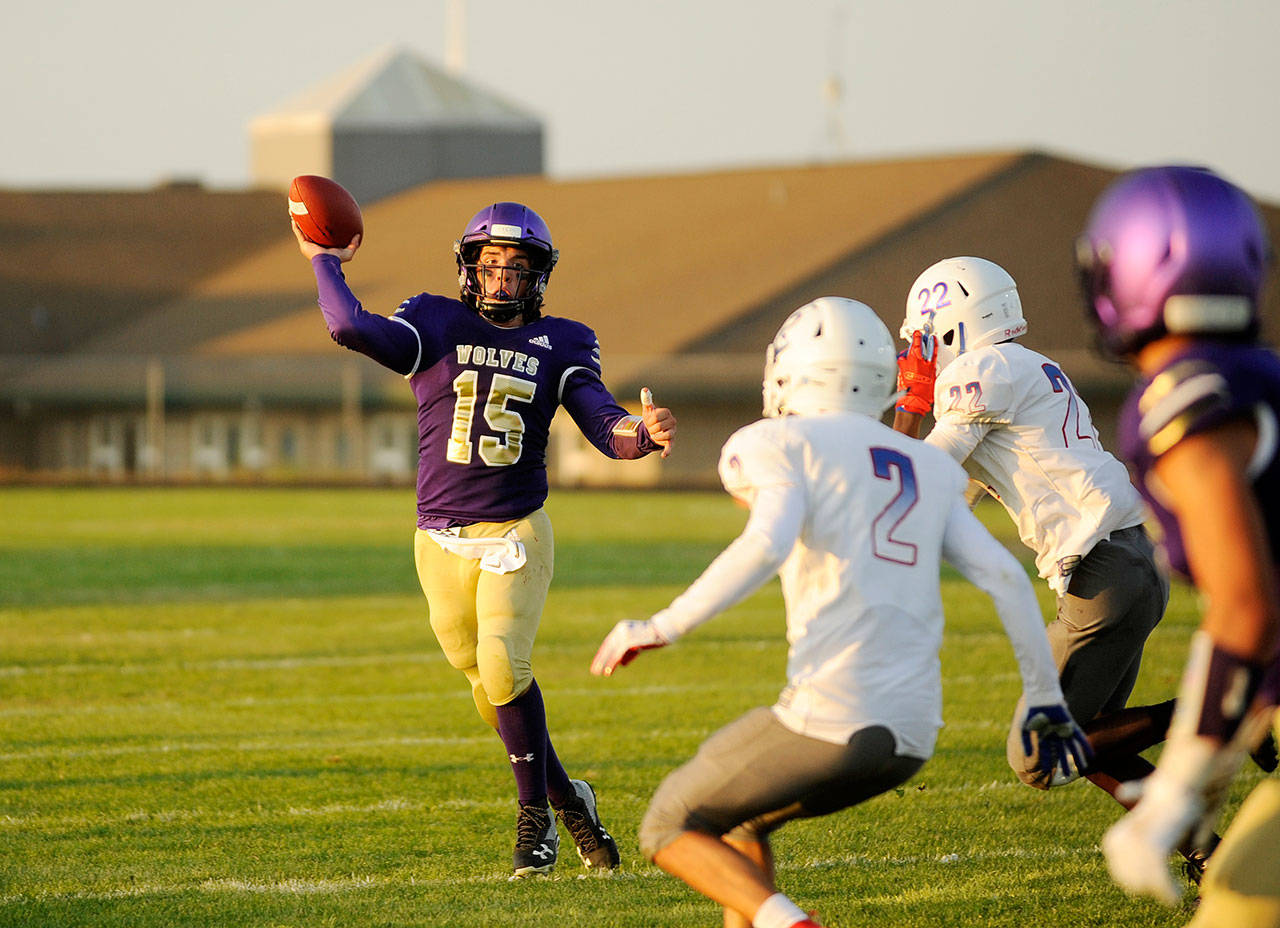 Sequim’s Taig Wiker was named the 2019 All-Olympic League Offensive MVP after throwing for 1,155 yards and 13 touchdowns, and running for 440 yards and 13 scores this season. Sequim Gazette file photos by Michael Dashiell