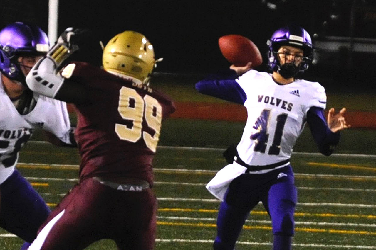 Sequim Wolves sophomore quarterback Kobe Applegate throws a pass in the first quarter of the Wolves’ 38-21 loss to the Lakewood Cougars in the 2A state playoffs on Nov. 15. Applegate was forced to start the game due to a knee injury suffered by Taig Wiker, but responded with a touchdown pass on the Wolves’ opening drive of the game. Sequim Gazette photo by Conor Dowley