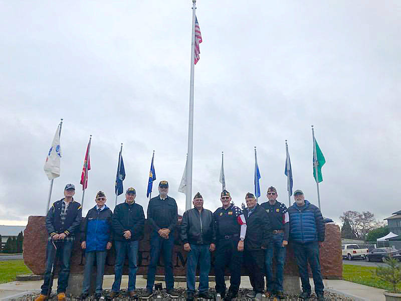 The Carlsborg VFW Post 6787 on Nov. 9 performs a flag replacement ceremony at the Sequim Veterans Memorial, located in front of the Sequim Museum & Arts building on North Sequim Avenue. The flags were replaced because of age and wear. Carlsborg VFW Post 6787 maintains the memorial, a tribute to veterans past and present. Participating in the flag replacement were Dallas Holman, Don Hyatt, Tom Cox, Mel Fisher, Larry Klinefelter, Post Commander Rod Lee, Joe Borden, Cal Barnard and Museum board member/veteran Bud Knapp. Submitted photo