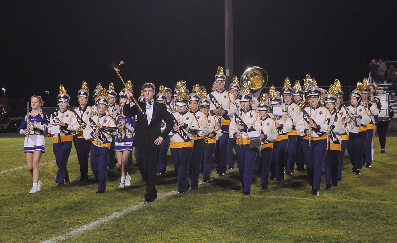The Sequim High School band entertains the crowd at halftime of the school’s Oct. 4 Homecoming football game. Band participation is down with 24-credit academic graduation requirements, SHS director Vern Fosket says. Sequim Gazette file photo by Michael Dashiell