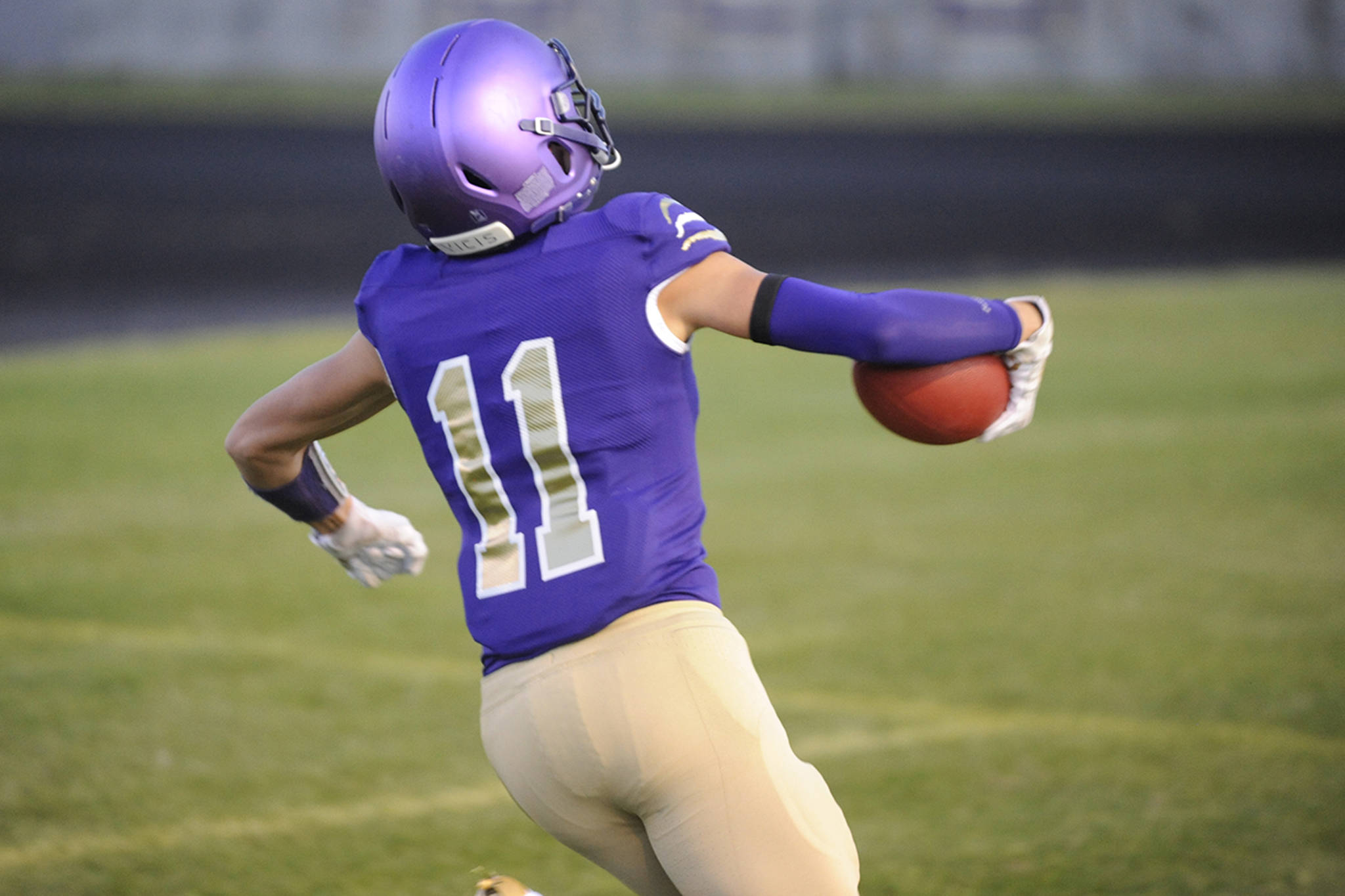 Michael Young scores a touchdown on the Sequim Wolves’ first drive against the Olympic Trojans on Oct. 11. Young would total 23 receptions for 432 yards and six touchdowns on the season and played shutdown defense as a cornerback to help earn first team All Olympic League honors on offense and defense. Sequim Gazette file photo by Conor Dowley