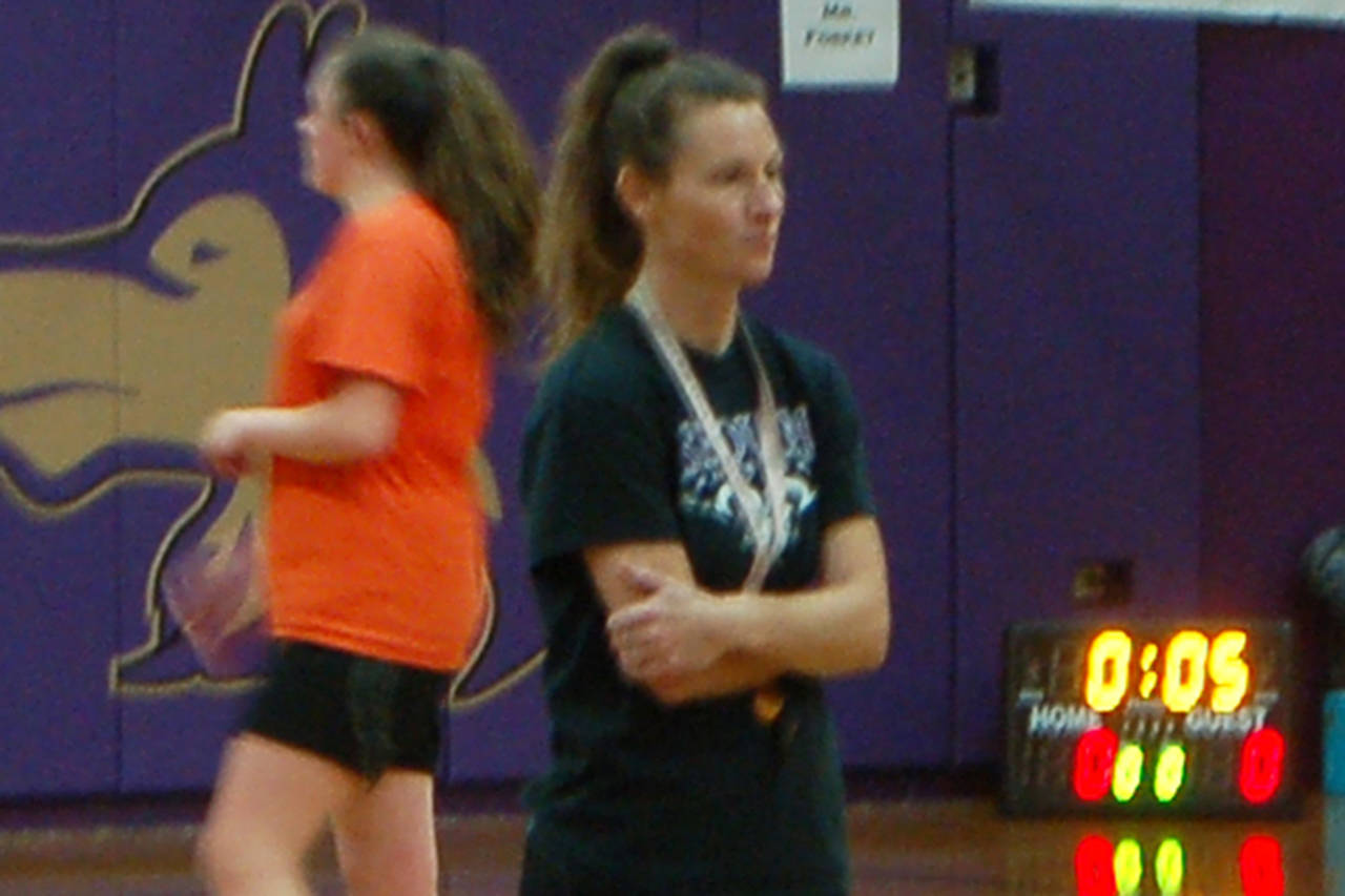 Sequim Wolves girls basketball head coach Linsay Rapelje observes a preseason practice of her team as they prepare for the first full season of her second tenure as head coach. Sequim Gazette photo by Conor Dowley