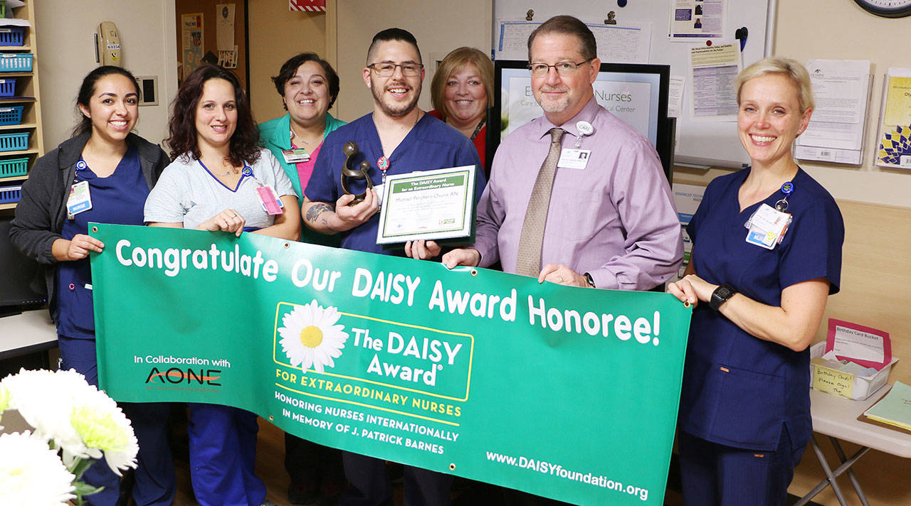 Pictured, from left, are nurses Catalina Gonzalez and Jeana Hutton, arrhythmia technician Carmen Moody, DAISY Award recipient Michael Perchert-Osuna, nurse/clinical supervisor-ICU/telemetry Janeen Howell, chief nursing officer Ralph Parker and nurse/director of ICU/telemetry Katrin Junghanns-Royack. Submitted photo