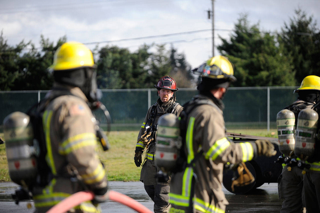 Captain Marc Lawson with Clallam County Fire District 3 works with recruits in 2016. Next year, fire district leaders look to add four more line staff bringing the total to 39 in 2020. Sequim Gazette photo by Michael Dashiell