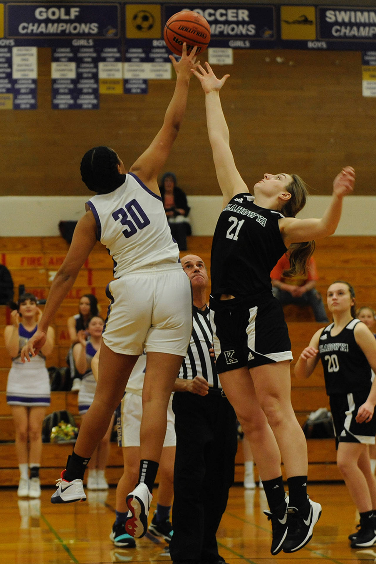 Sequim Wolves’ center Jayla Julmist, 30, wins the opening tipoff of the Wolves’ 73-17 win over the Klahowya Eagles on Dec. 2. Julmist earned a double-double on the night, leading the Wolves with 18 points and contributing 10 rebounds, along with five assists, two steals, and two blocks. Sequim Gazette photo by Conor Dowley