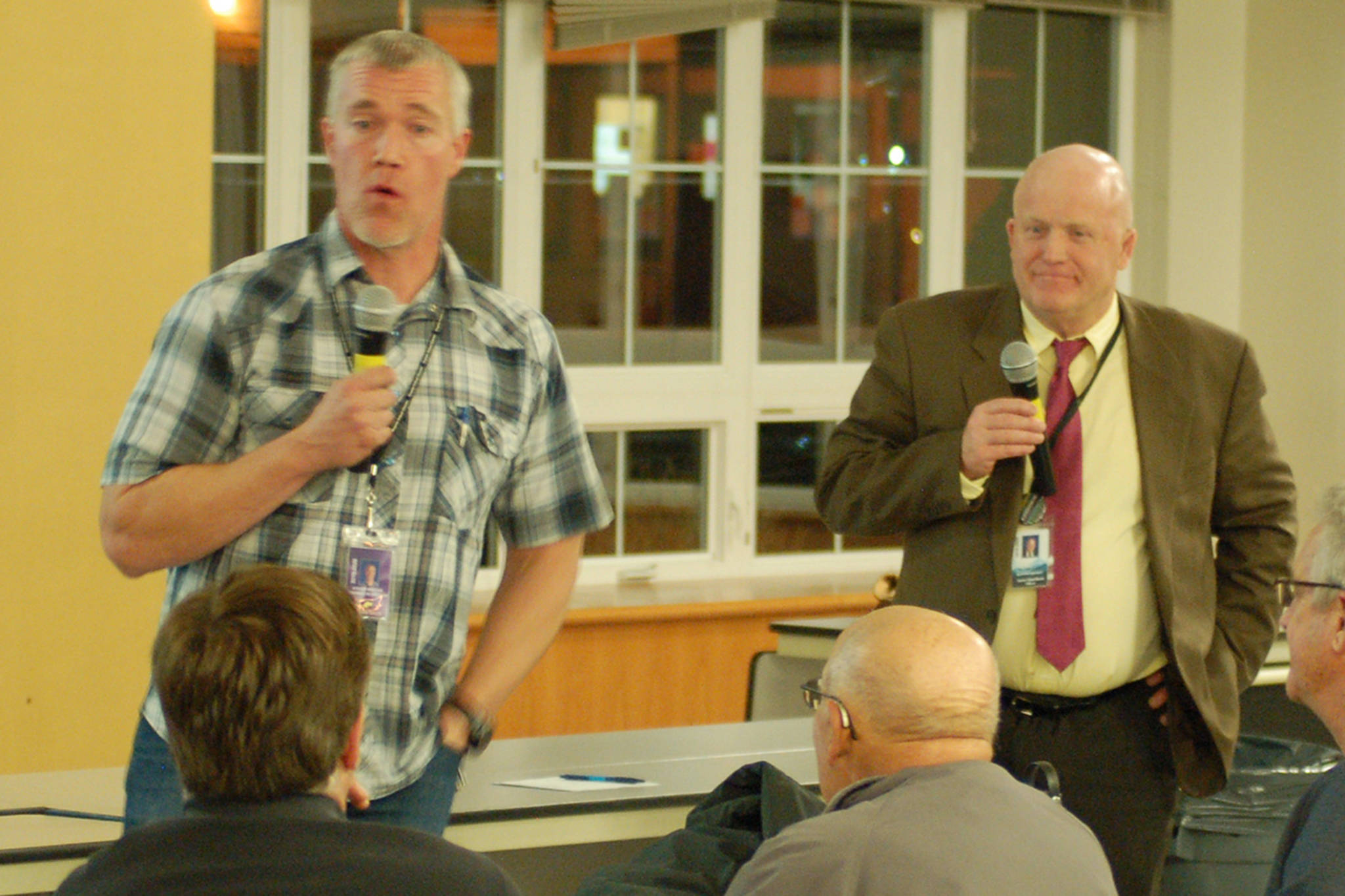Sequim High School career & technical education director Steve Mahitka, left, and Sequim School District interim superintendent Rob Clark, right, address the audience during a question and answer segment of the SHS CTE forum on Dec. 3 to introduce the Skillmation program the district will soon be using. Sequim Gazette photo by Conor Dowley