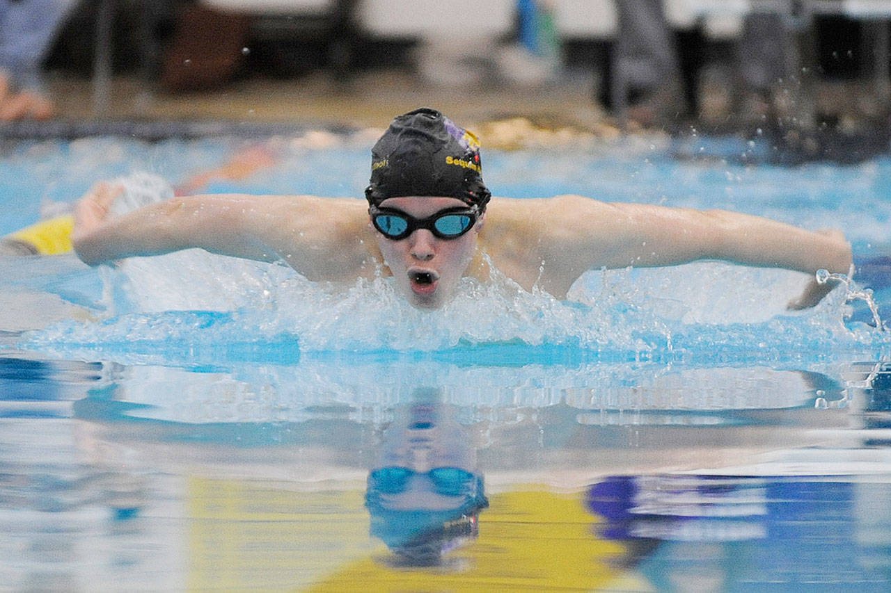 Junior Kaleb Needoba, pictured here swimming the 100 butterfly against North Kitsap in January, is one of seven key returning swimmers for the Wolves this season. 10. Sequim Gazette file photo by Michael Dashiell