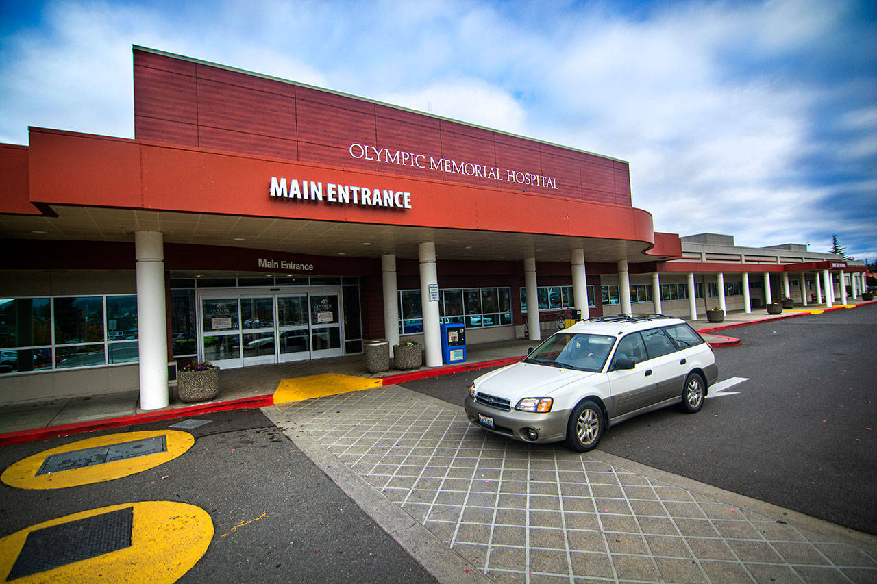 A car drives in front of the main entrance of Olympic Medical Center on Monday. Photo by Jesse Major/Olympic Peninsula News Group