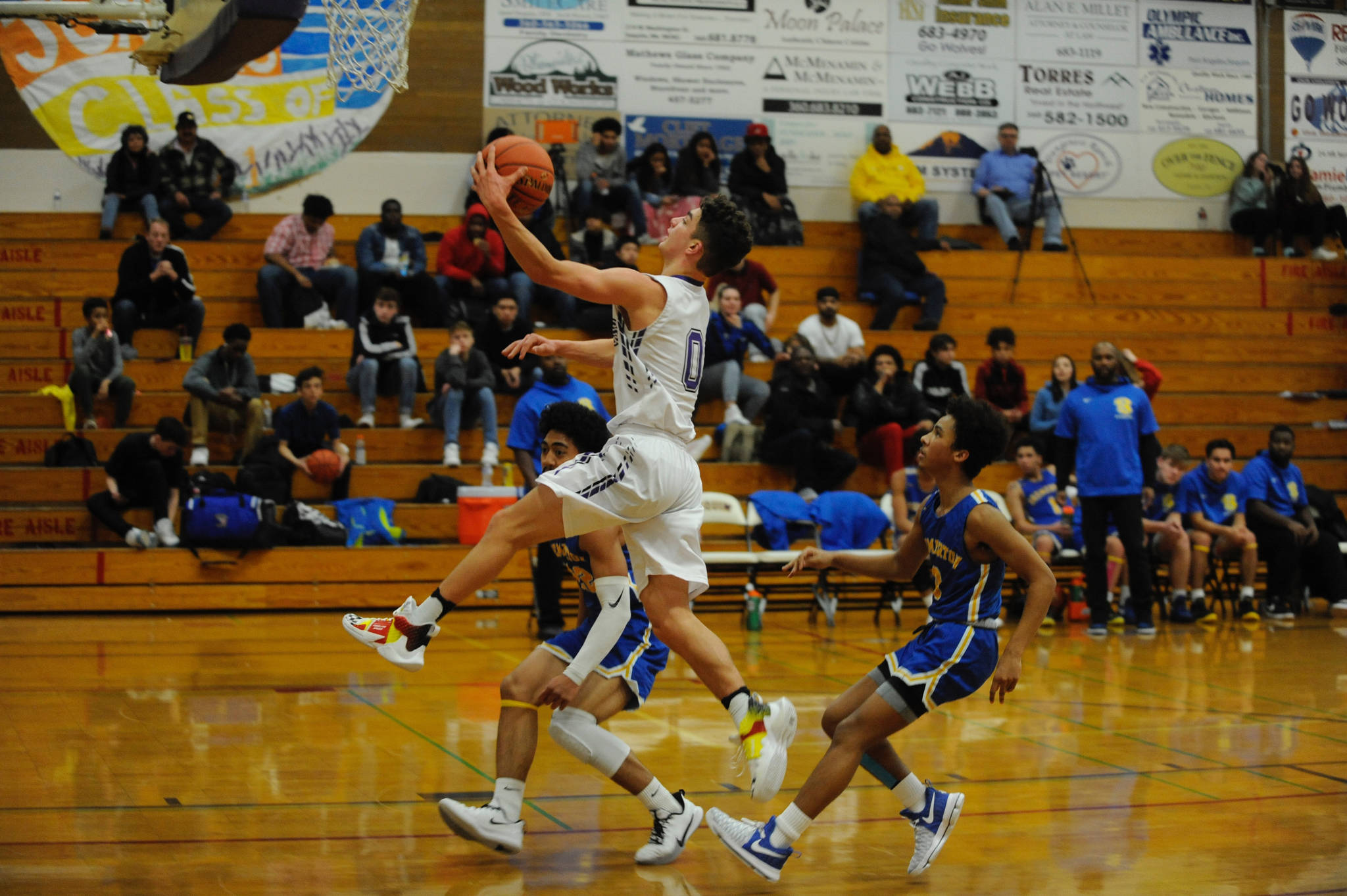 Sequim’s Dallin Despain (0) goes up for a fast-break layup in the second quarter of the Sequim Wolves’ 77-62 loss to the Bremerton Knights on Dec. 17.