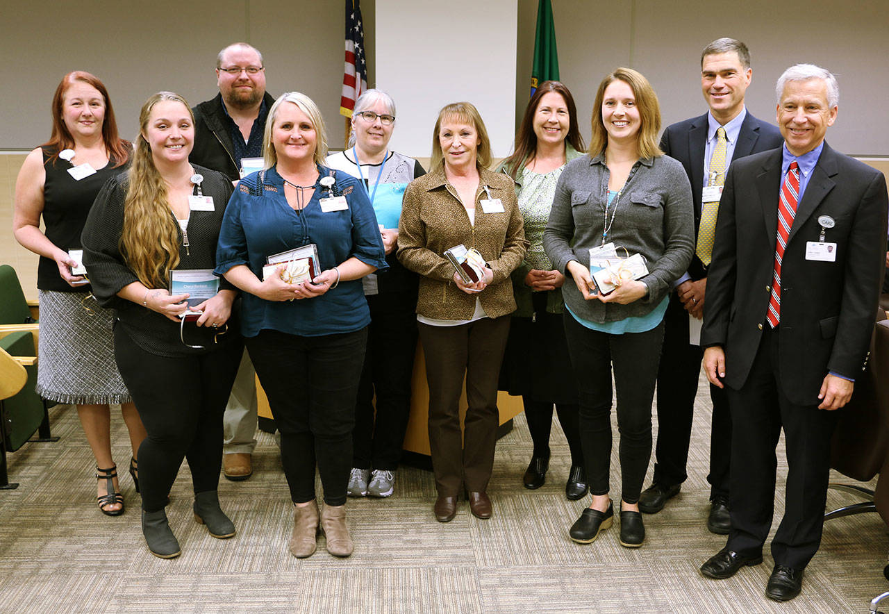 Pictured, from left, are Debbie Callahan, Cheryl Bankson, Terry Wray, Nicole Jackson, Kim Goss, Renee Sommers, Joanna Weber, Piper Grall, Darryl Wolfe and Eric Lewis. Photo courtesy of Olympic Medical Center