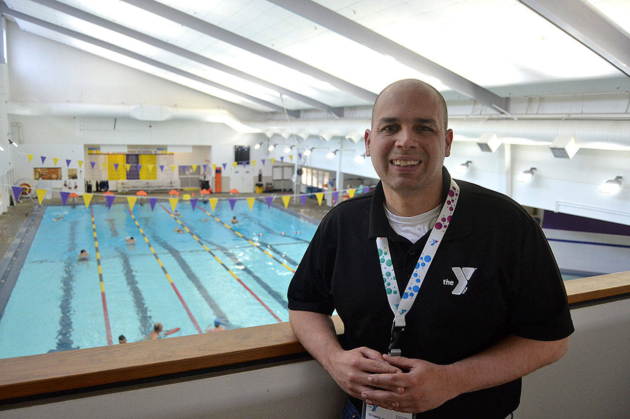 Kurt Turner, executive director of the YMCA of Sequim, overlooks the pool during the last week of work leading the facility. He helped ready it for opening in October 2016 and gain more than 6,000 members in his tenure. He’s leaving to take over multiple YMCA branches near Austin, Texas. Sequim Gazette photo by Matthew Nash