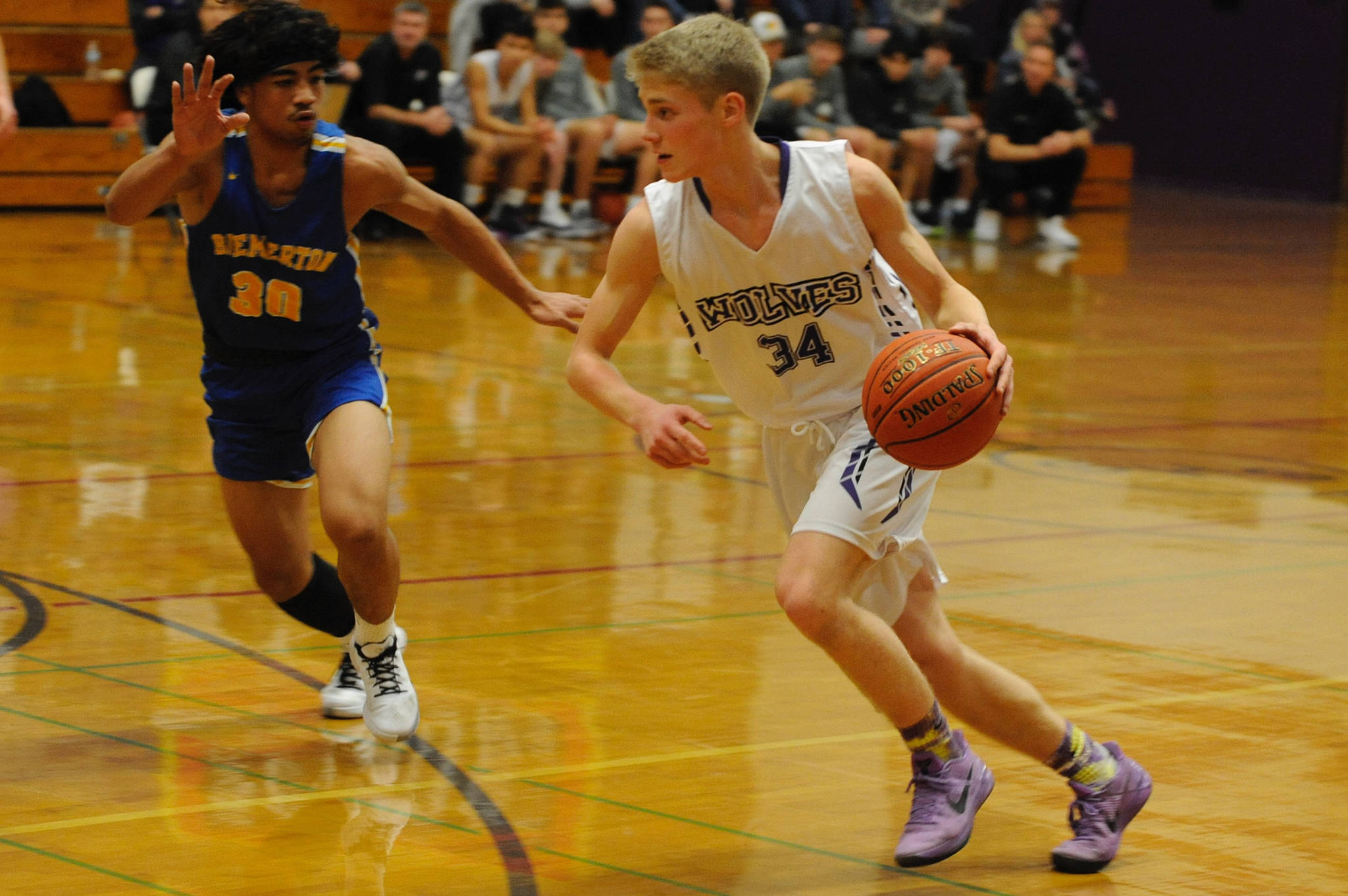 Erik Christiansen, 34, pictured playing against the Bremerton Knights on Dec. 17, lead the Wolves in scoring at the Cloud 9 Classic in Lynden with 38 points, including scoring 27 against the Sehome Mariners on Dec. 28. Sequim Gazette file photo by Conor Dowley