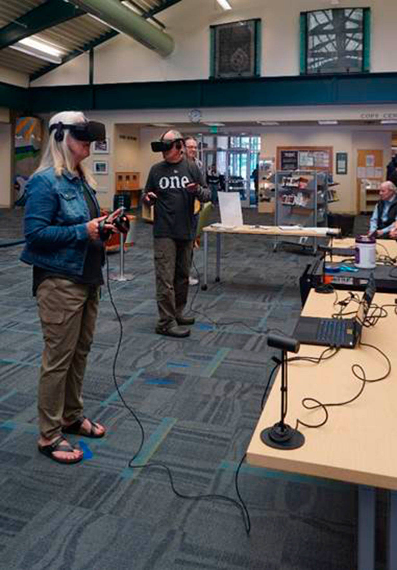 Patrons at the Port Angeles Library try out virtual reality. Multiple events continue in Port Angeles and Sequim for patrons 13 and up to try. Registration is required. Photo courtesy of NOLS