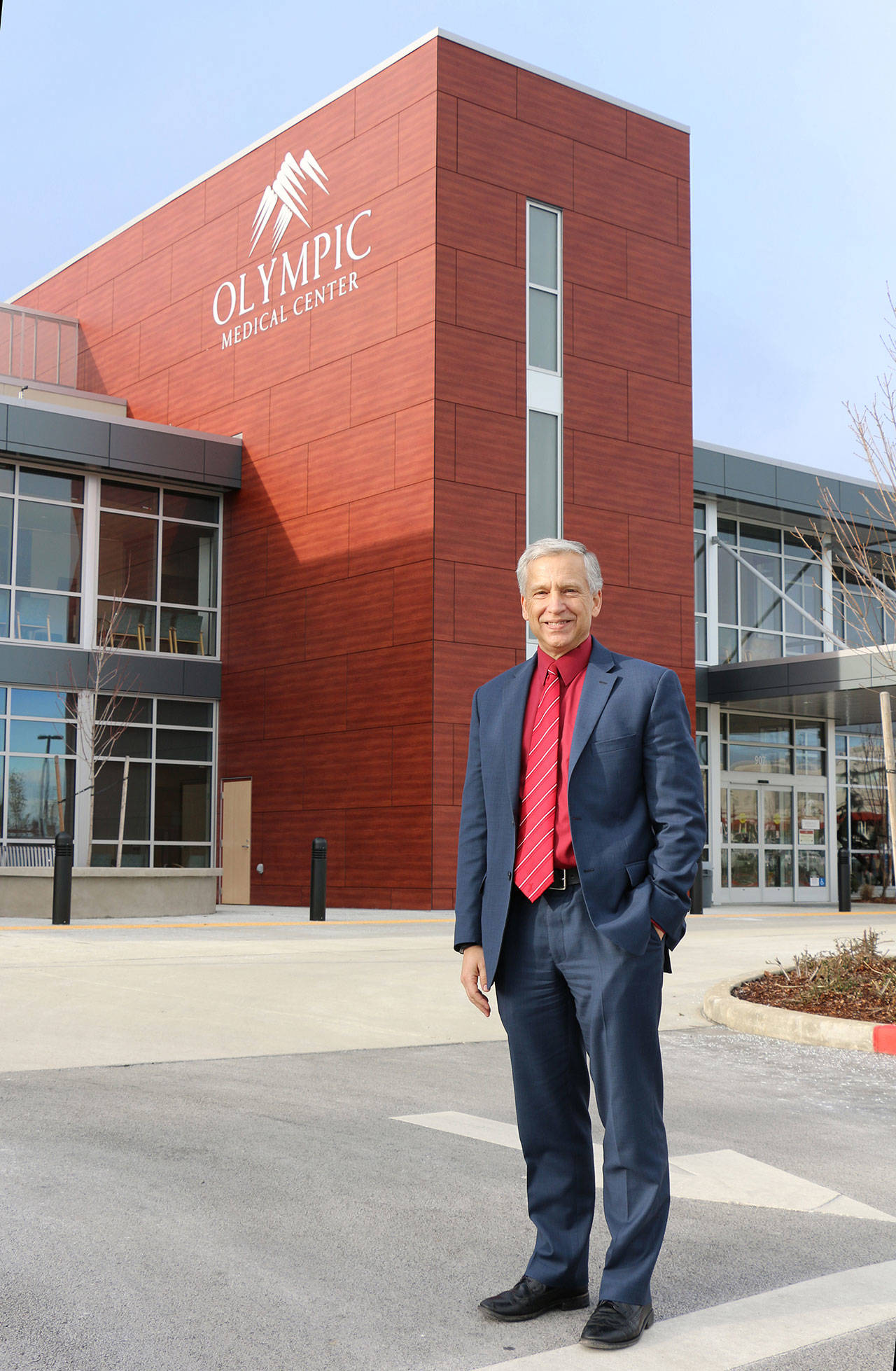 Olympic Medical Center CEO Eric Lewis, pictured here outside OMC’s main campus in Port Angeles, announced his intention to retire in May. Photo courtesy of Olympic Medical Center