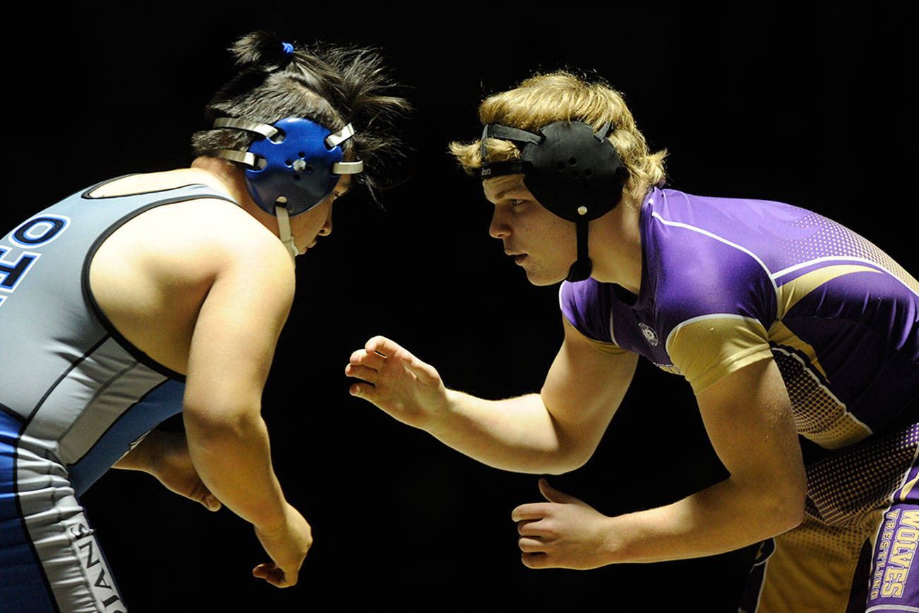 Wrestling: ‘Grit’ helps Wolves pick up wins in lone home meet