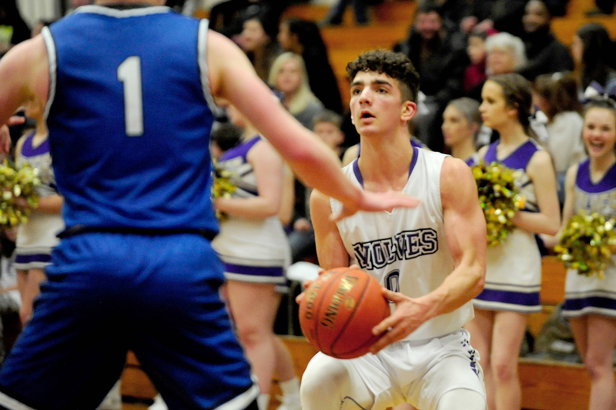Wolves’ guard Dallin Despain sets up for amid-range shot against the North Mason Bulldogs on Jan. 22. Despain scored nine points on the night and his defense was key to the Wolves’ holding North Mason off in the fourth quarter as they secured a 51-26 win. Sequim Gazette photo by Conor Dowley