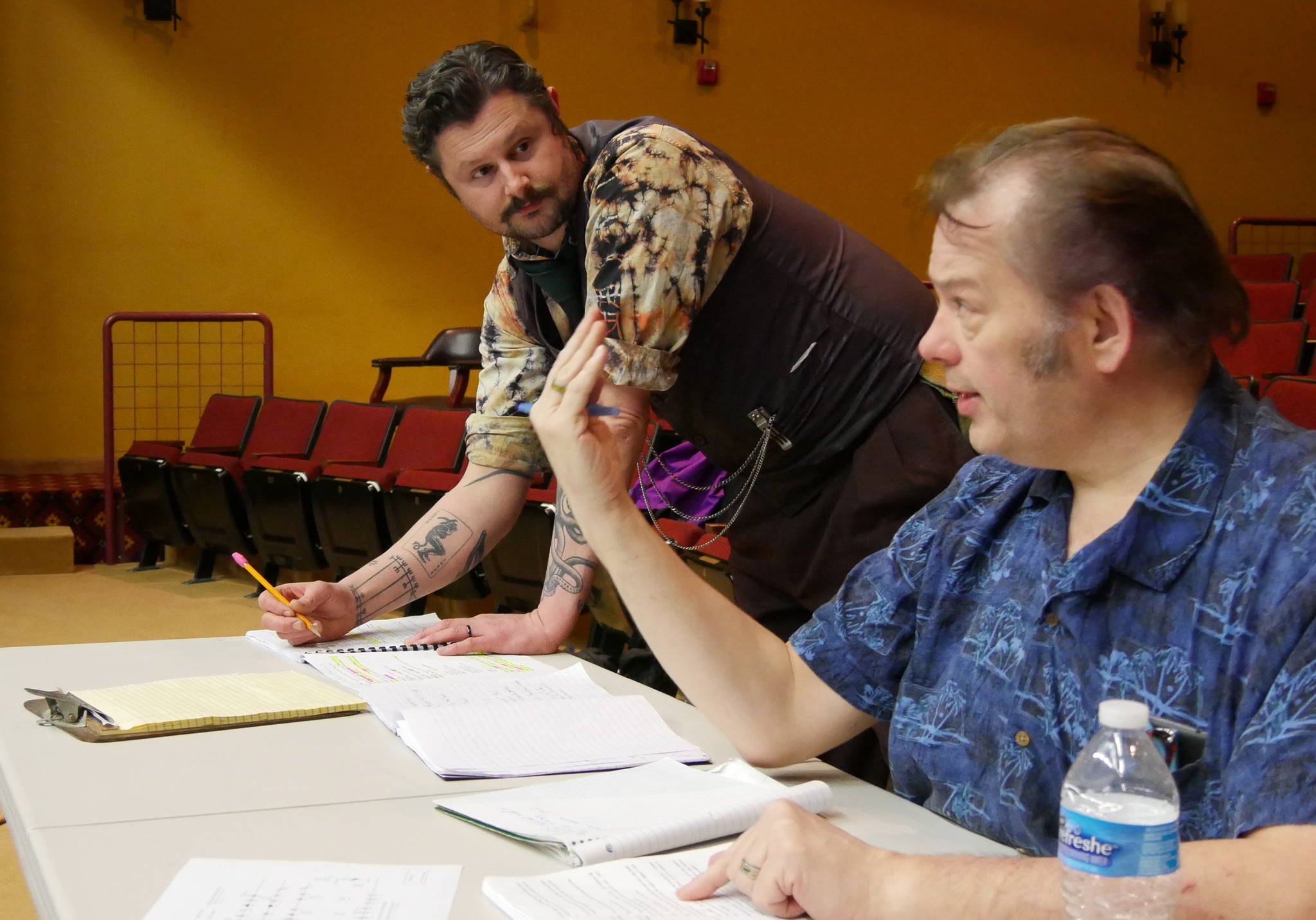 Director Richard Stephens, right, gives notes on “blocking” (actors’ positioning and movement on stage) while stage manager E.J. Anderson III records the information for future rehearsals. Photo courtesy of Olympic Theatre Arts