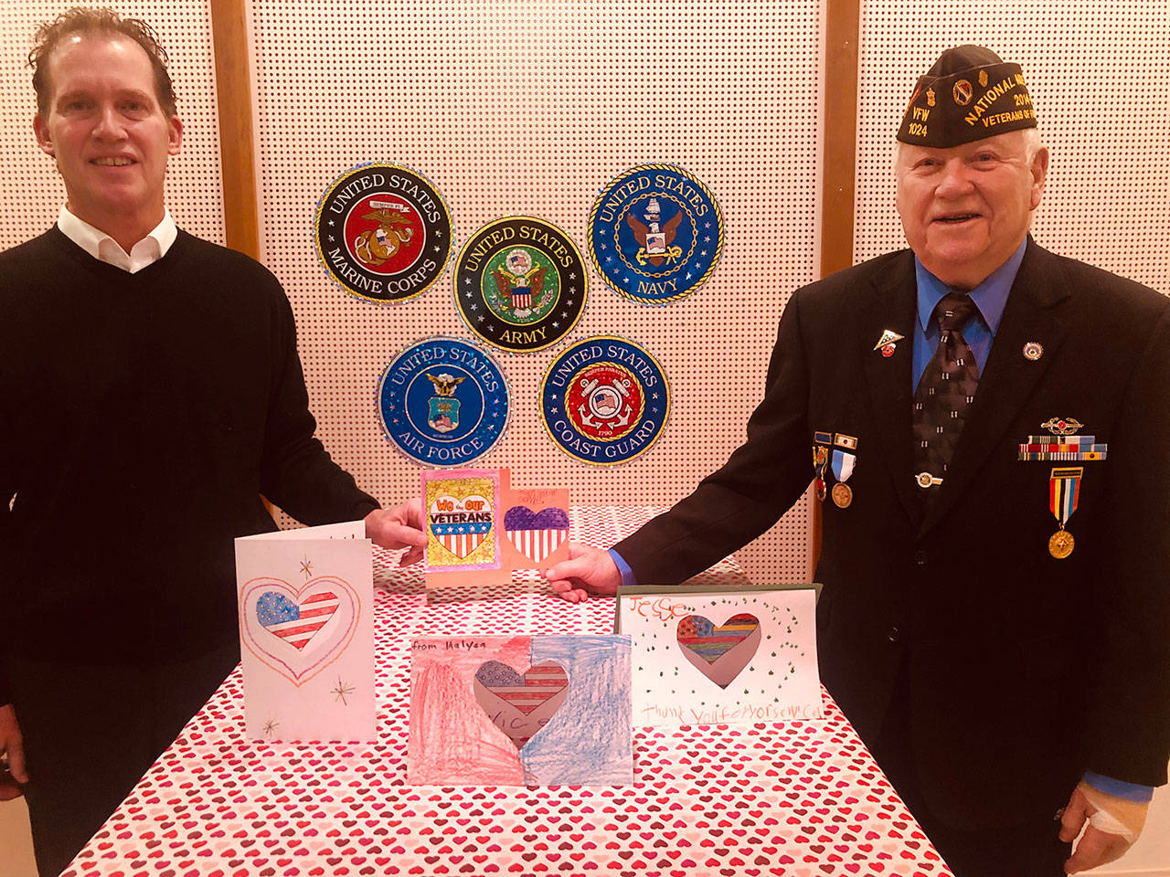 Funeral home co-owner and founder, Steve Ford, left, and Gerald “Jerry” Rettela of the Korean War Veterans Association #310, show some of the valentine cards collected by the funeral home’s 10th annual Operation Valentine program. The cards were created by most Clallam County school students and teachers, area scouts, youth groups, churches, businesses and local residents. The hundreds of cards will be personally distributed by Retella to active duty personnel, and veterans both locally and regionally. For more information, call Ford at 360-457-1210, email to info@drennanford.com or see www.drennanford.com or www.facebook.com/drennanfordfuneralhome. Submitted photo