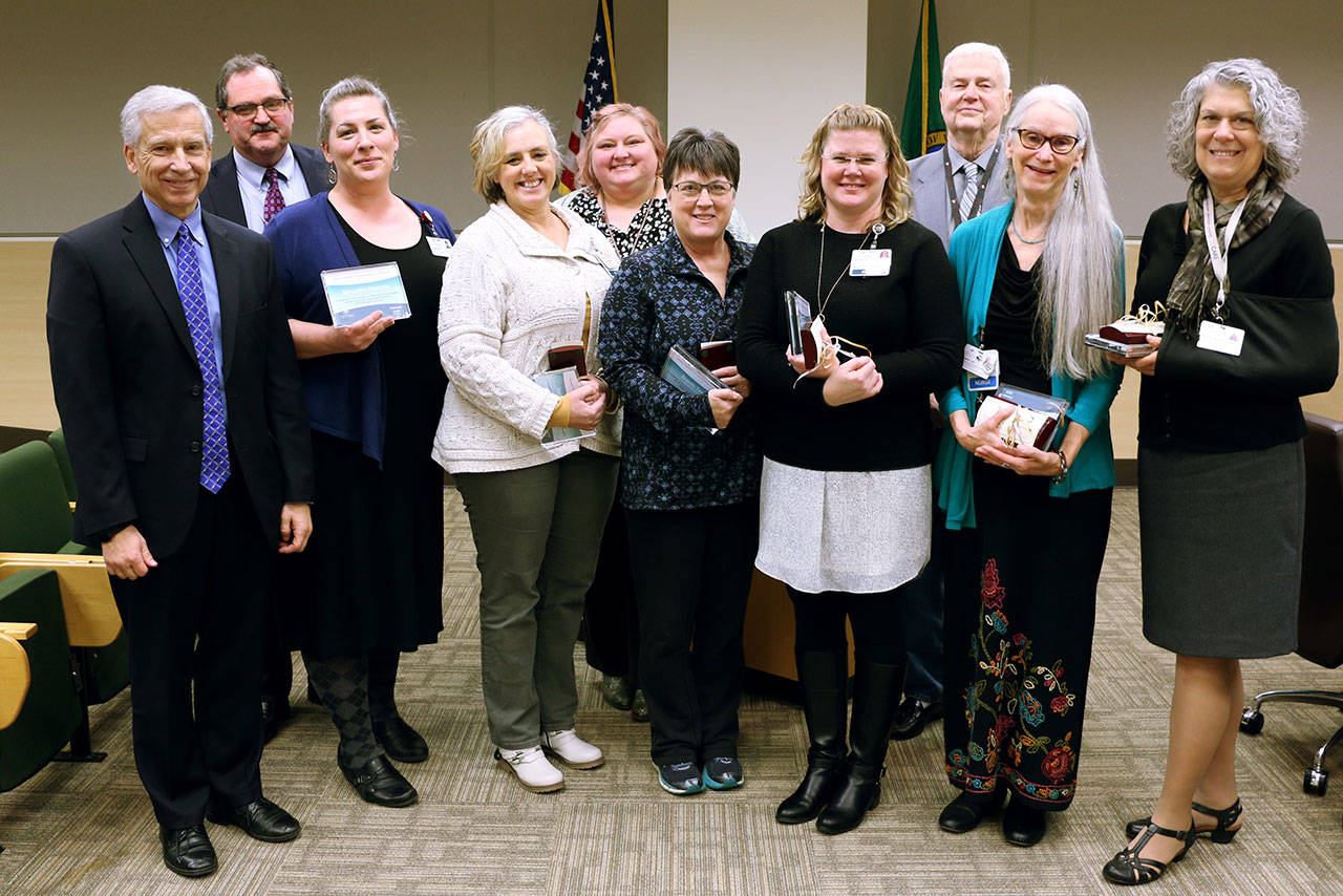 Pictured, from left, are OMC CEO Eric Lewis, CMO Scott Kennedy, Sam Reynolds, Holly Wickersham, director of quality support services Liz Uraga, Brenda Tassie, Michelle Samples, board president Jim Leskinovitch, Sandy Ulf and Paula Wahl. Not pictured is Carol Kittrick.