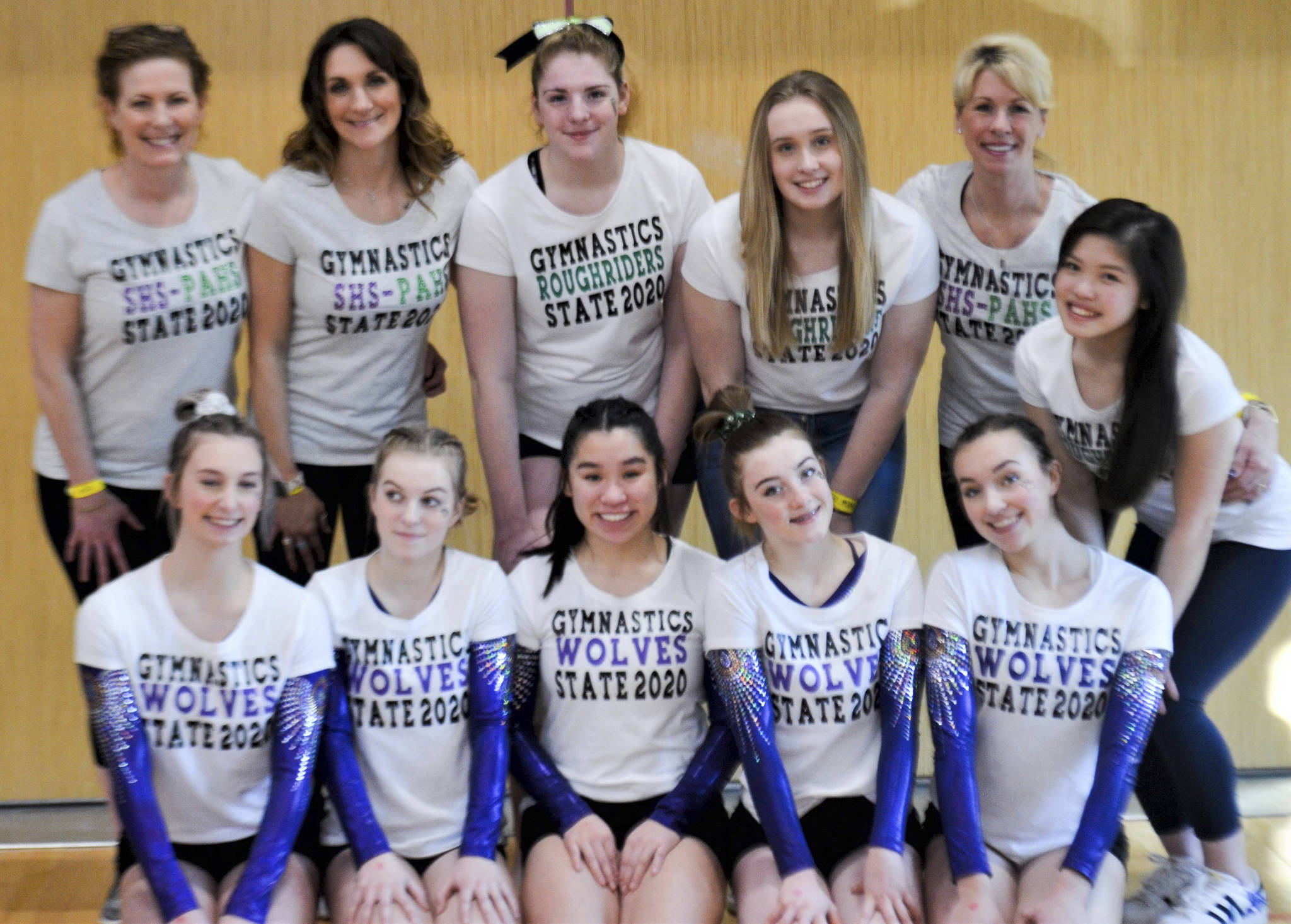 The combined Sequim-Port Angeles team takes a break from competition at the state 1A/2A/3A meet held in bellevue last week. Pictured are (back row, from left) head coach Jackie Mangano, assistant coach Rachel Sharp, Aiesha LaTourette, manager Mazie Tucker, volunteer coach Julie Haguewood and manager Mei Ying Harper-Smith, with (from left) Sequim’s Emma Sharp, Kori Miller, Lesae Pfeffer, Danica Pierson and Gracie Sharp. Submitted photo