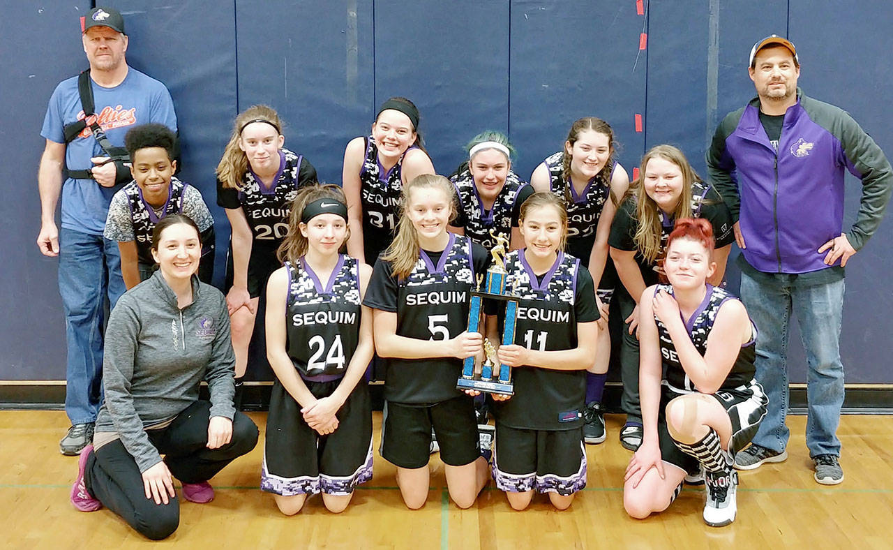 The Sequim Select Eighth Grade girls basketball squad celebrates second place finish at the 32nd-annual Vernon Youth Basketball Tournament, held Feb. 29-March 1 at Black Hills High School inn Tumwater. Pictured are (back row, from left) coach Ray Vaara, Joy Munyagi, Krista Charters, Danielle Herman, Korbyn Donning, Ava Fuller, Ciara Rowden and head coach Travis Johnson, with (front row from left) coach Kate Harman, Kaitlyn Bloomenrader, Jolene Vaara, Taryn Johnson and Roslyn Guille. Photo courtesy of Heather Herman