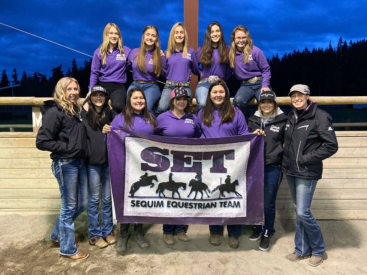 The Sequim Equestrian Team is all smiles at the first district meet of the 2020 season in Elma this past weekend. Pictured are (back row, from left) Lexi King, Hannah Kokoschko, Grace Niemeyer, Emma Albright and Keri Tucker, with (front row, from left) coach Bettina Hoesel, coach Sydney Balkan, Abby Garcia, Abbi Priest, Lilly Thomas, coach Haylie Newton and coach Katie Newton. Submitted photo
