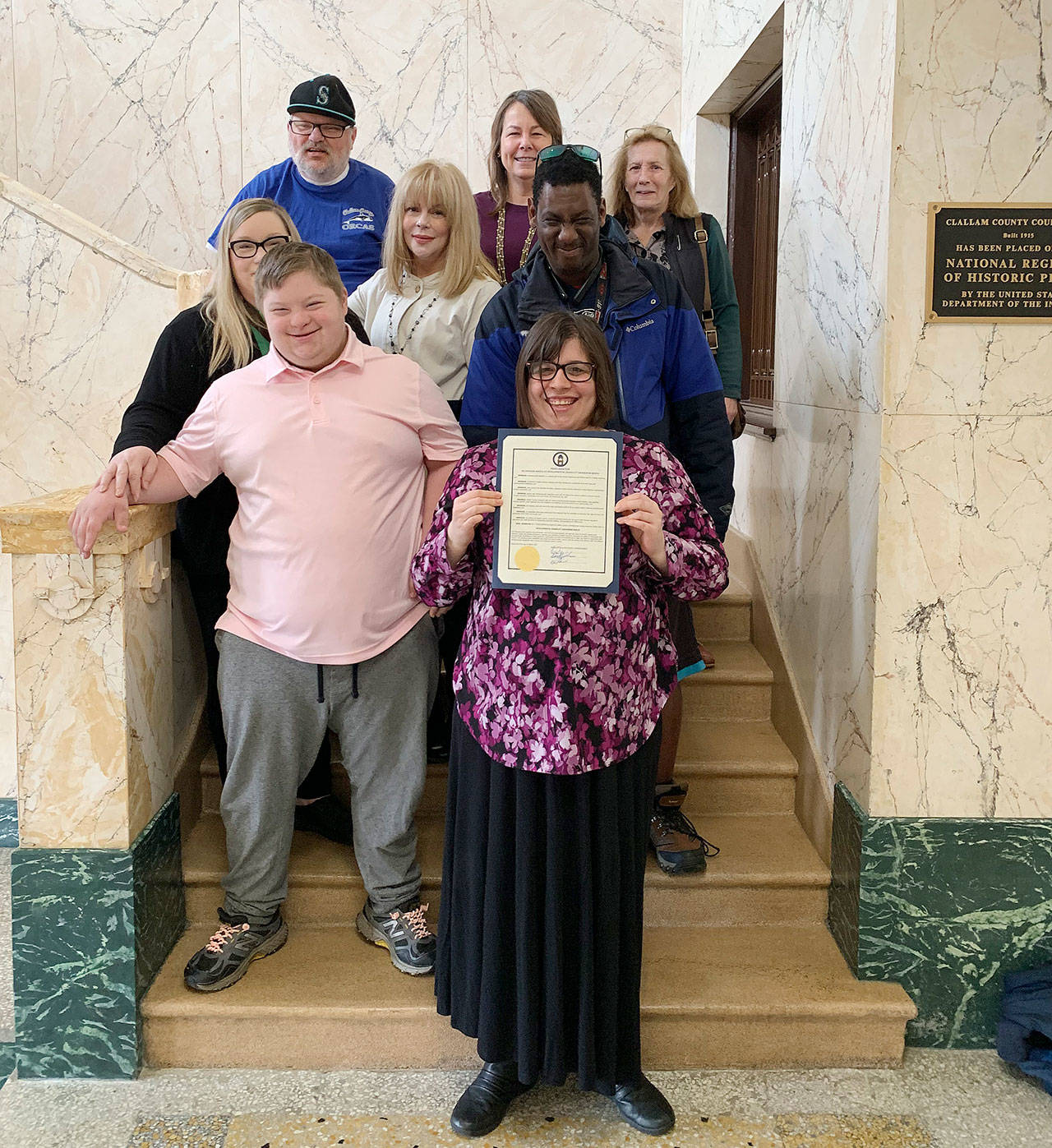 Celebrating Developmental Disabilities Awareness Month are (back row, from left) Patrick McFarland, Virginia O’Neil and Karen Pierce, (middle row, from left) Shawnda Hicks, Kelley Lawrence and Tony Andrus, and (in front, from left) Grayson Hicks and Riley O’Neil. Photo by Chelsea Lierly