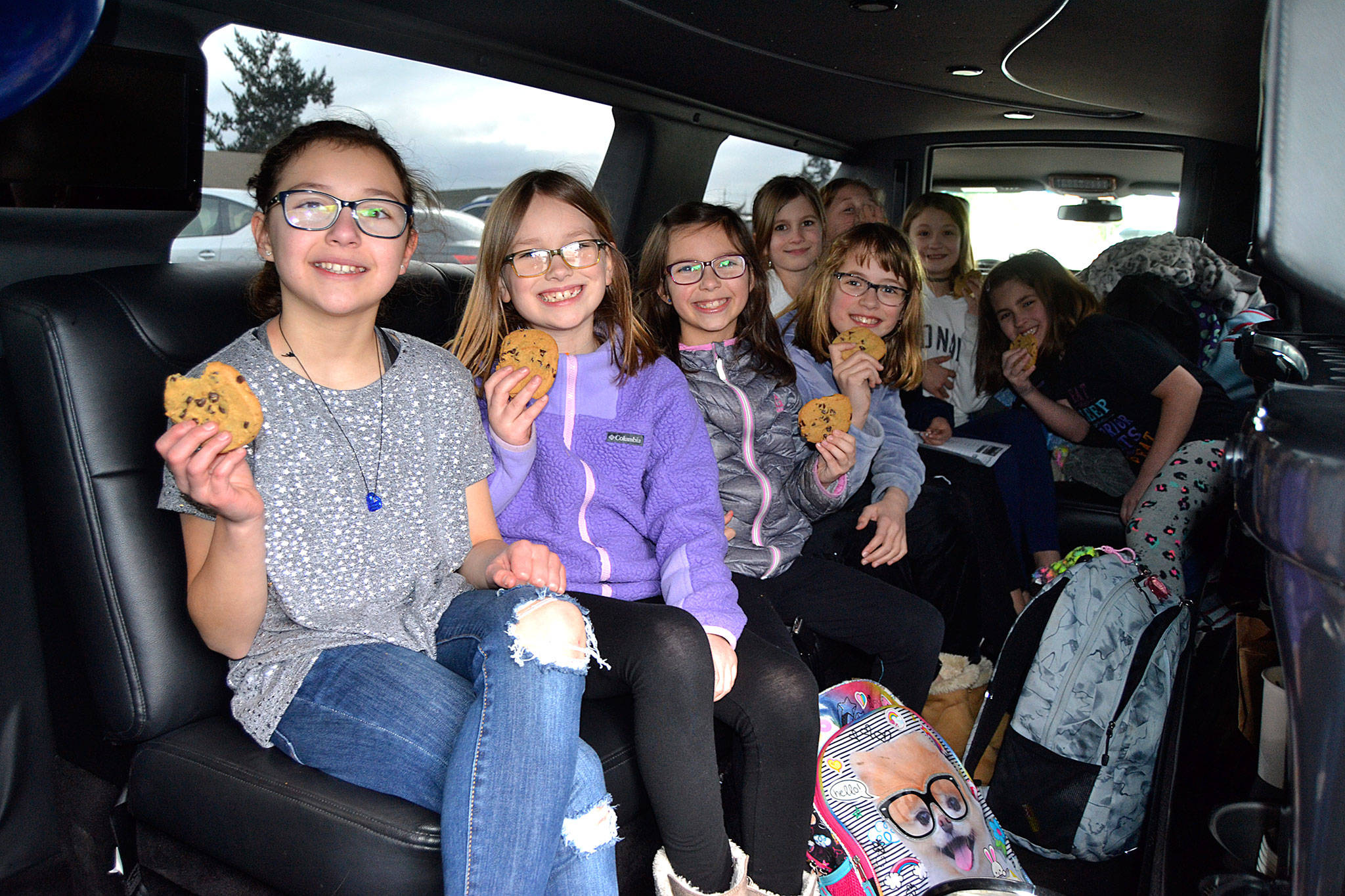 Fourth grader Maci Evans, left, readies for a limo ride with her friends on Feb. 24 after receiving the most financial support for grades 3-5 at last November’s Turkey Trot. Sequim Gazette photo by Matthew Nash