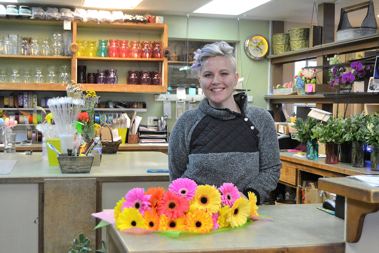 Lacey Lovell, new owner Sofie’s Florist, recently shared some cheer with free bouquets for some downtown businesses. “I make a point of shopping local,” she said. “It’s my way of life. I believe in small businesses. They are the ones who support your community, your sports and arts. They support the things you believe in.” Sequim Gazette photo by Matthew Nash