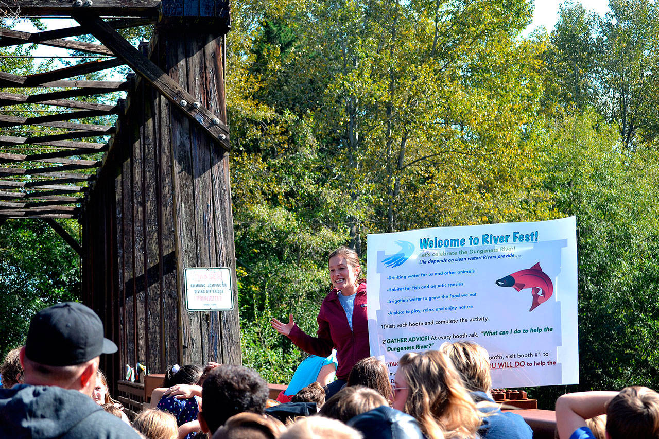 Jenna Ziogas, education coordinator for the Dungeness River Audubon Center, welcomes Greywolf Elementary fifth-graders atop the Railroad Bridge as they ready to go to the Dungeness River Festival in September 2019. The center is closed though the bridge, park and Olympic Discovery Trail remain open. Sequim Gazette file photo by Matthew Nash