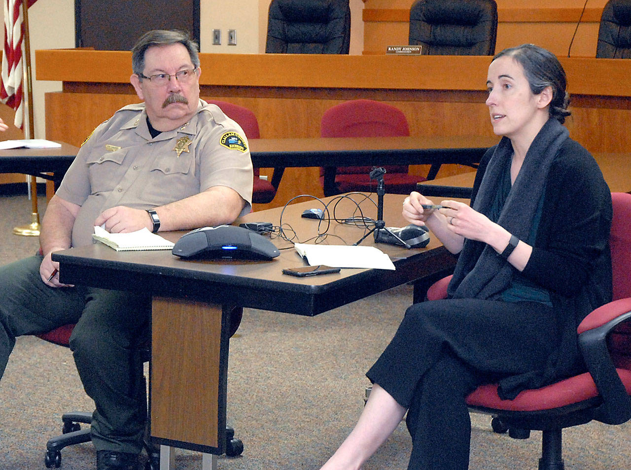 Dr. Allison Berry Unthank, Clallam County public health officer, right, provides an update on the novel coronavirus as Clallam County Undersheriff Ron Cameron listens in Tuesday, March 17, at the Clallam County Courthouse in Port Angeles. Photo by Keith Thorpe/Olympic Peninsula News Group