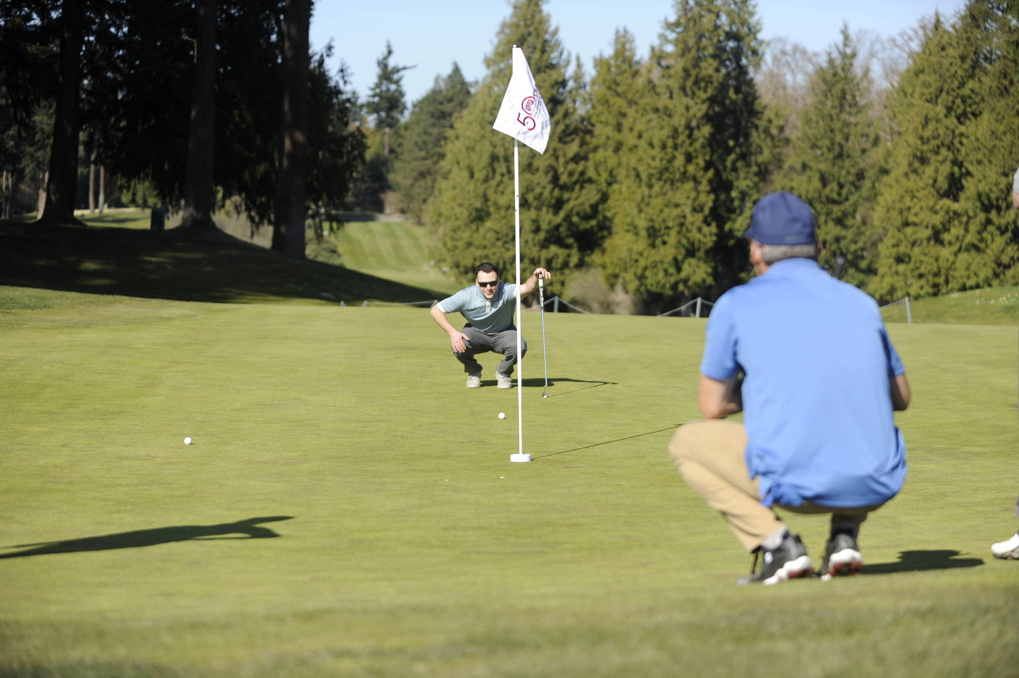 Brendan Winger of Port Angeles lines up a putt at The Cedars at Dungeness last week. Sequim Gazette photo by Michael Dashiell