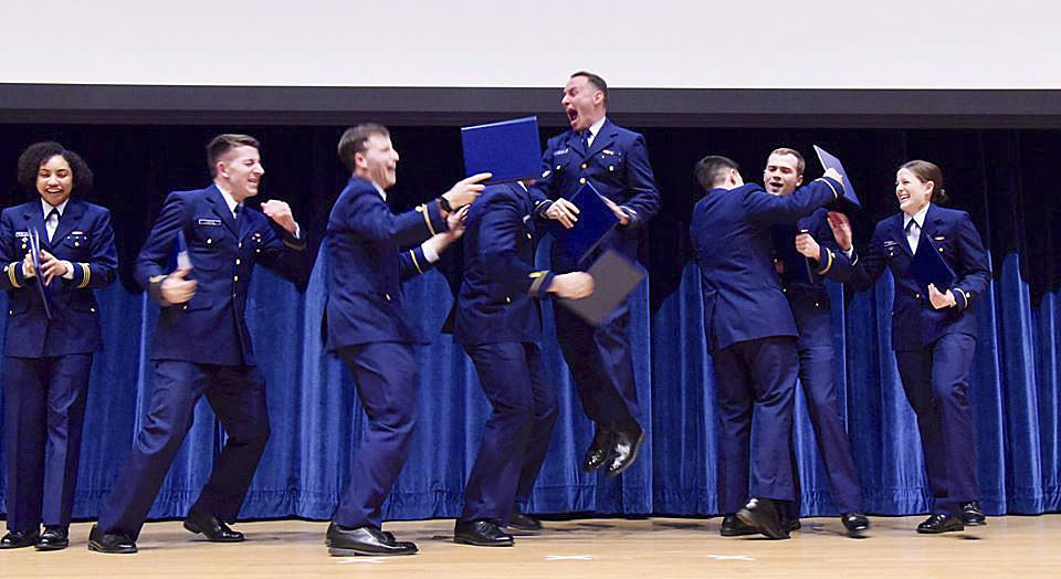 Sequim High grad Miguel Moroles, fifth from left, and fellow U.S. Coast Guard Academy students react to being told they’ve qualified for the academy’s flight school. Submitted photo