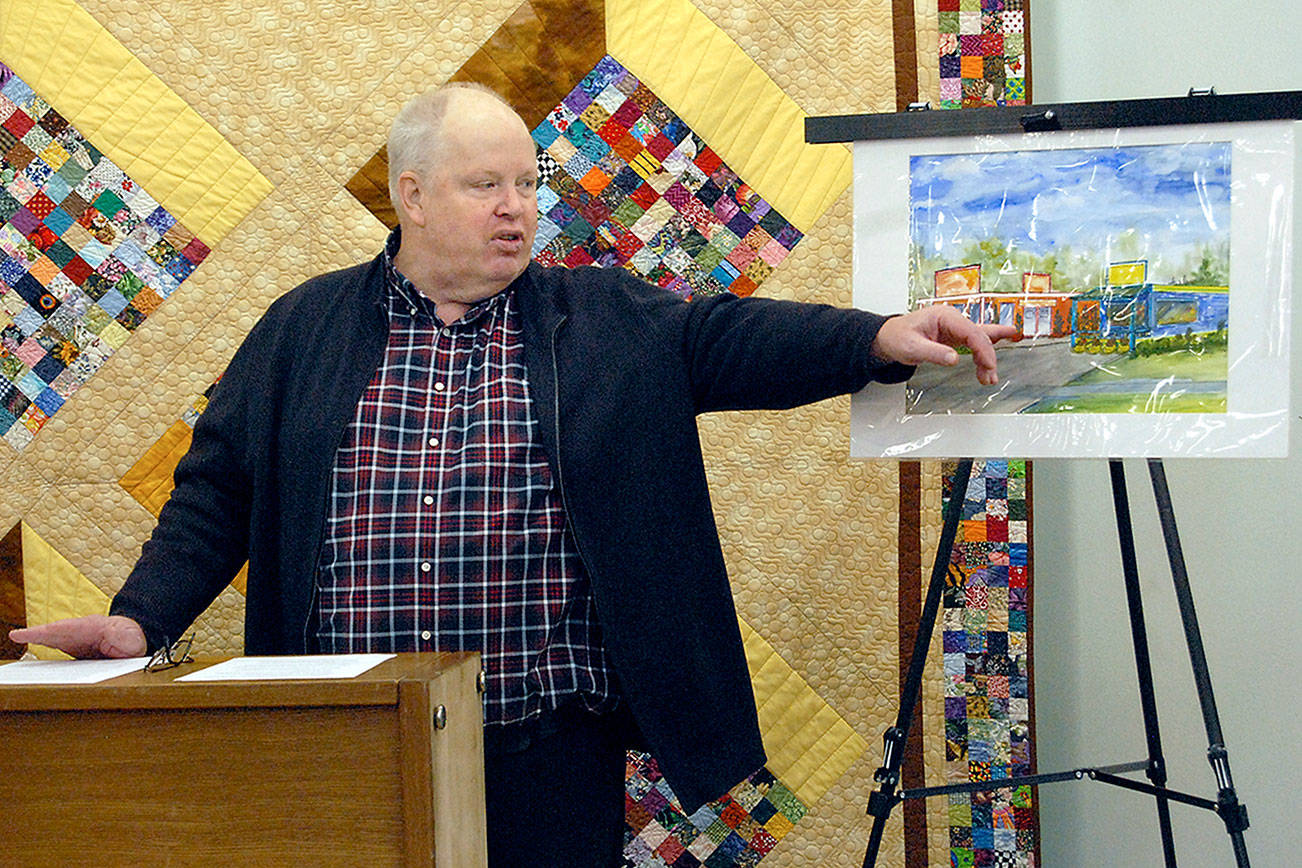 Richard “Doc” Robinson, executive director of Serenity House of Clallam County, points to an artist’s rendering of the Bridges Grill and a nearby laundromat on Eighth Street in Port Angeles that were under consideration for purchase by his agency to provide services for homeless young adults in this Dec. 15, 2018, file photo. Robinson has left his post at Serenity House. Photo by Keith Thorpe/Olympic Peninsula News Group