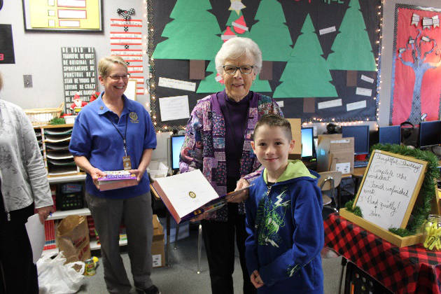Rotarian Rochelle, Barbara Hughes and a Greywolf student. Photos from Rotary Club of Sequim archive files
