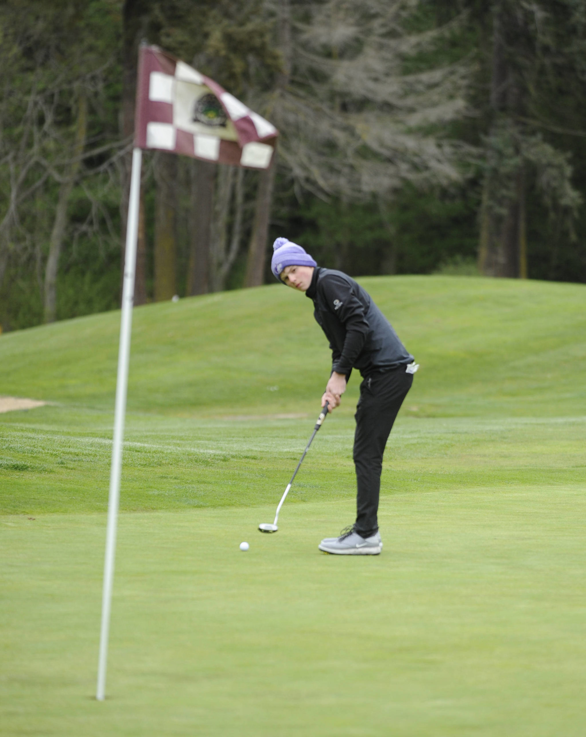 Sequim’s Ben Sweet looks to sink a putt on the first hole at The Cedars at Dungeness in 2019. The returning sophomore earned a top-20 finish at the state 2A tourney as a freshman. Sequim Gazette file photo by Michael Dashiell