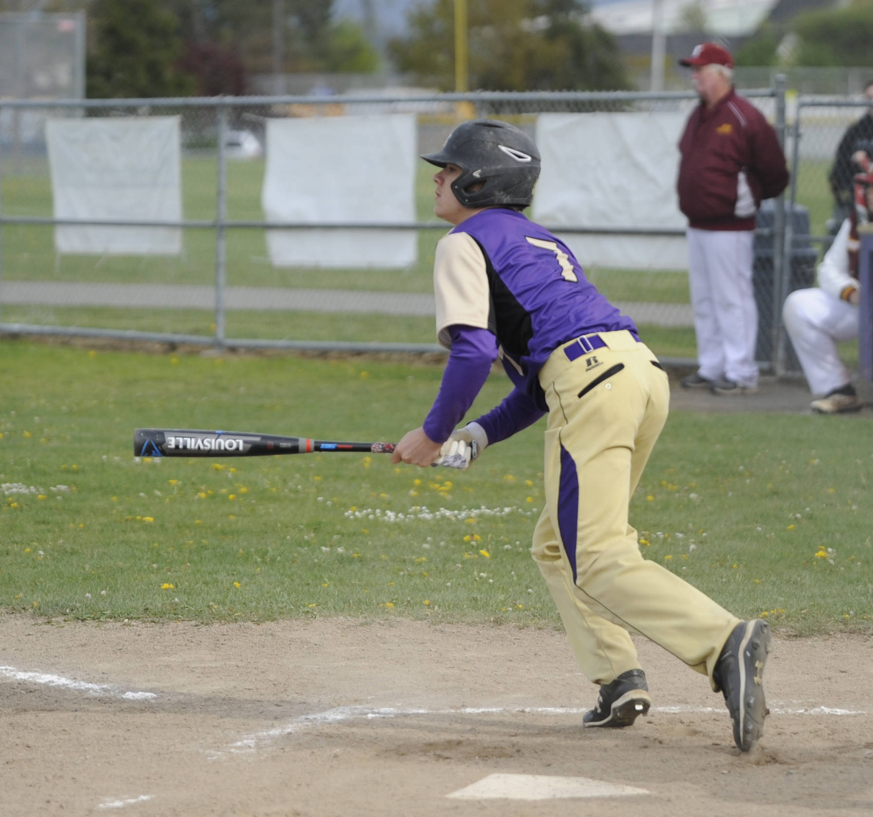 Sequim High’s Silas Thomas rips a single to center field in the Wolves’ Olympic league win over Kingston on in April 2019. The all-Olympic League second team outfielder figures to lead the Wolves’ pitching rotation in 2020. Sequim Gazette file photo by Michael Dashiell
