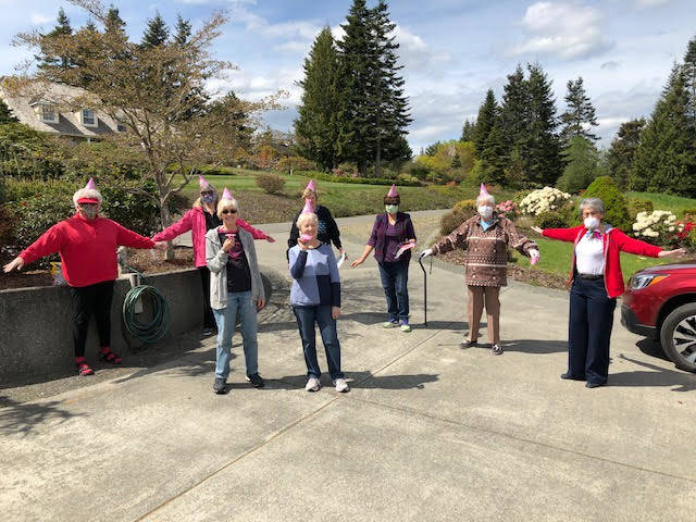 Ladies of a Wednesday breakfast group living on Highland Hills decided to surprise their neighbor, Sheron Duffy, on April 29 by turning up outside her driveway on Ravens Ridge to bring cards, flowers and sing to her “Happy Birthday.” Photo courtesy of Kathryn Haskell